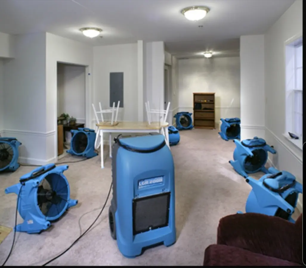 Air movers and dehumidifier setup for Water Damage Restoration in Mena